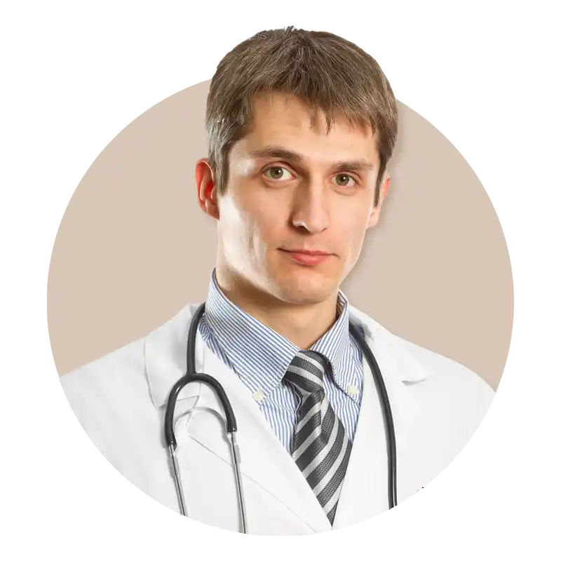Un médico masculino con una bata blanca y un estetoscopio.